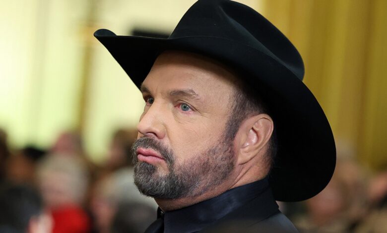 Garth Brooks calls rape case extortion and slander