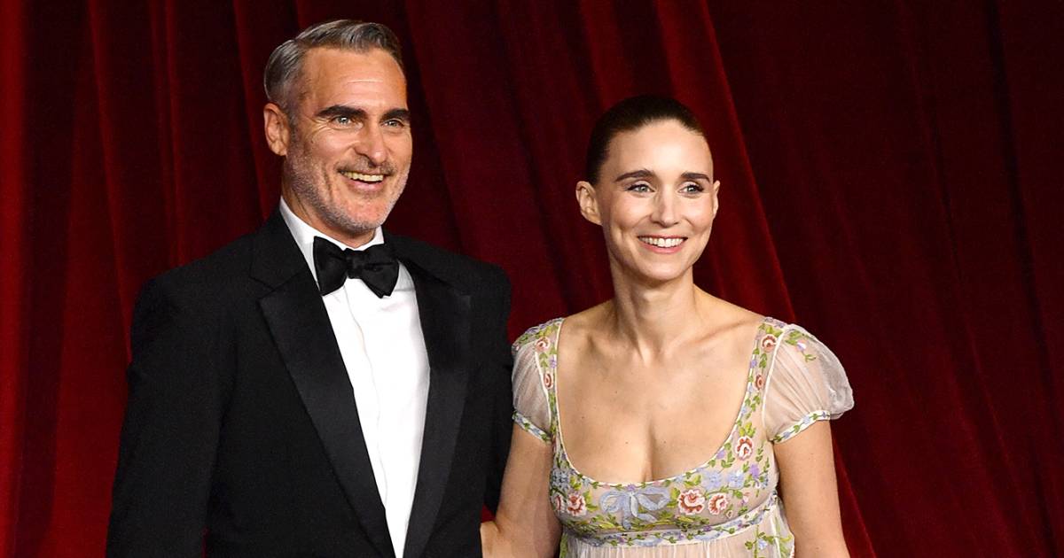 Joaquin Phoenix fixes Rooney Mara's train at Academy Gala