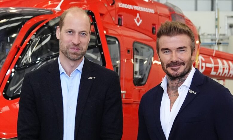 Prince William and David Beckham pose during royal charity visit