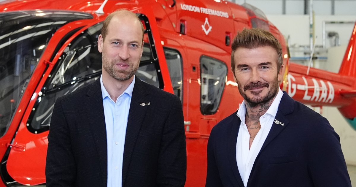 Prince William and David Beckham pose during royal charity visit