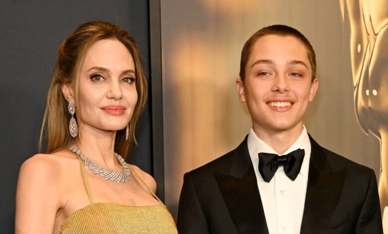 Angelina Jolie beams with pride next to son Knox during a rare public outing