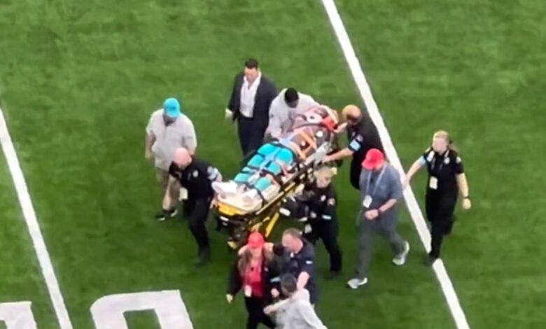 Miami Dolphins receiver Grant DuBose is stretched out off the field in a scary scene