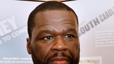 50 cents charged for mistreatment by photog who claimed that Rapper's SUV hit him