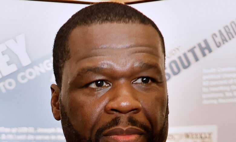 50 cents charged for mistreatment by photog who claimed that Rapper's SUV hit him