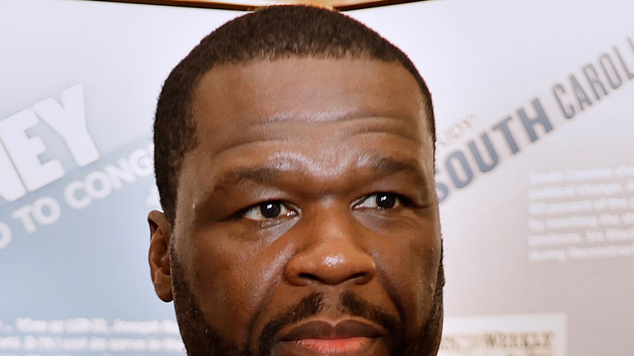 50 cents charged for mistreatment by photog who claimed that Rapper's SUV hit him