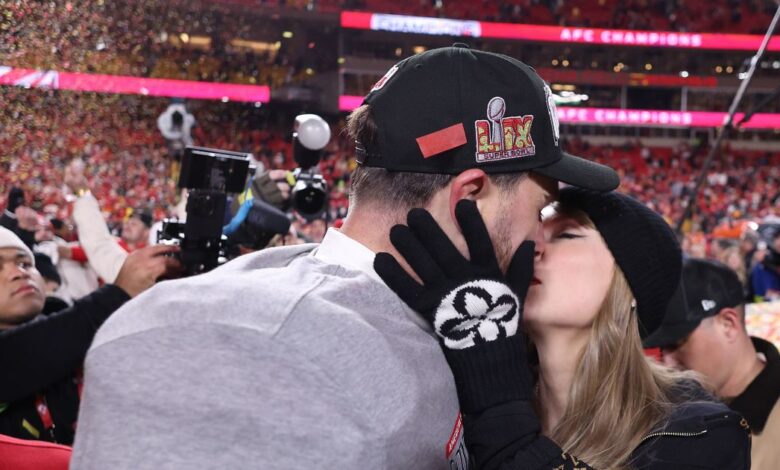 Taylor Swift kisses and hugs Travis Kelce on the field after the Chiefs win