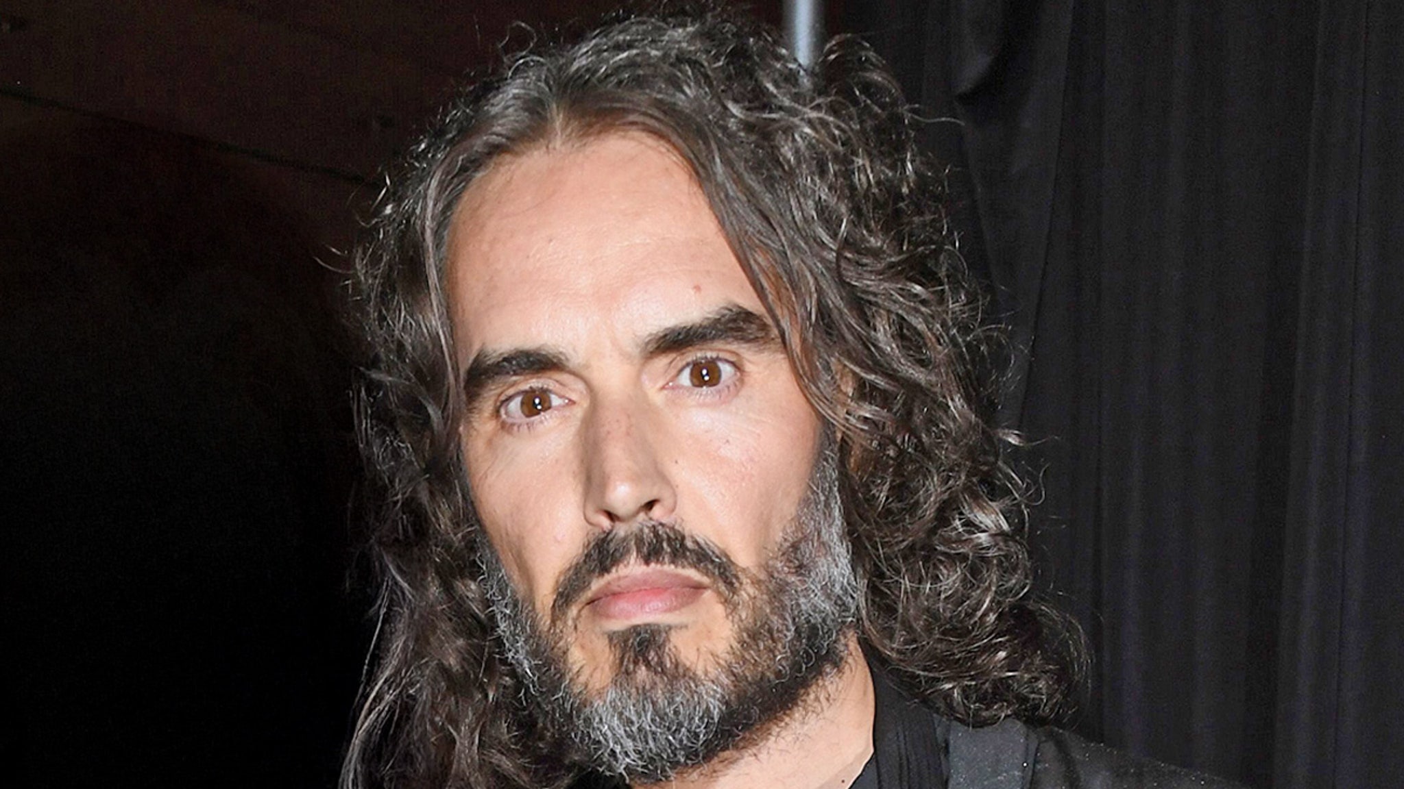 Russell Brand appears in London Court for rape, granted bail