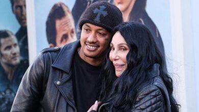Cher hugs to friend Alex 'AE' Edwards in the midst of Familyage Meditis