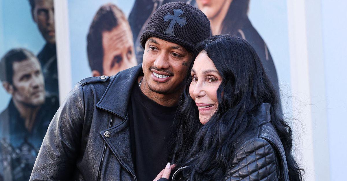 Cher hugs to friend Alex 'AE' Edwards in the midst of Familyage Meditis
