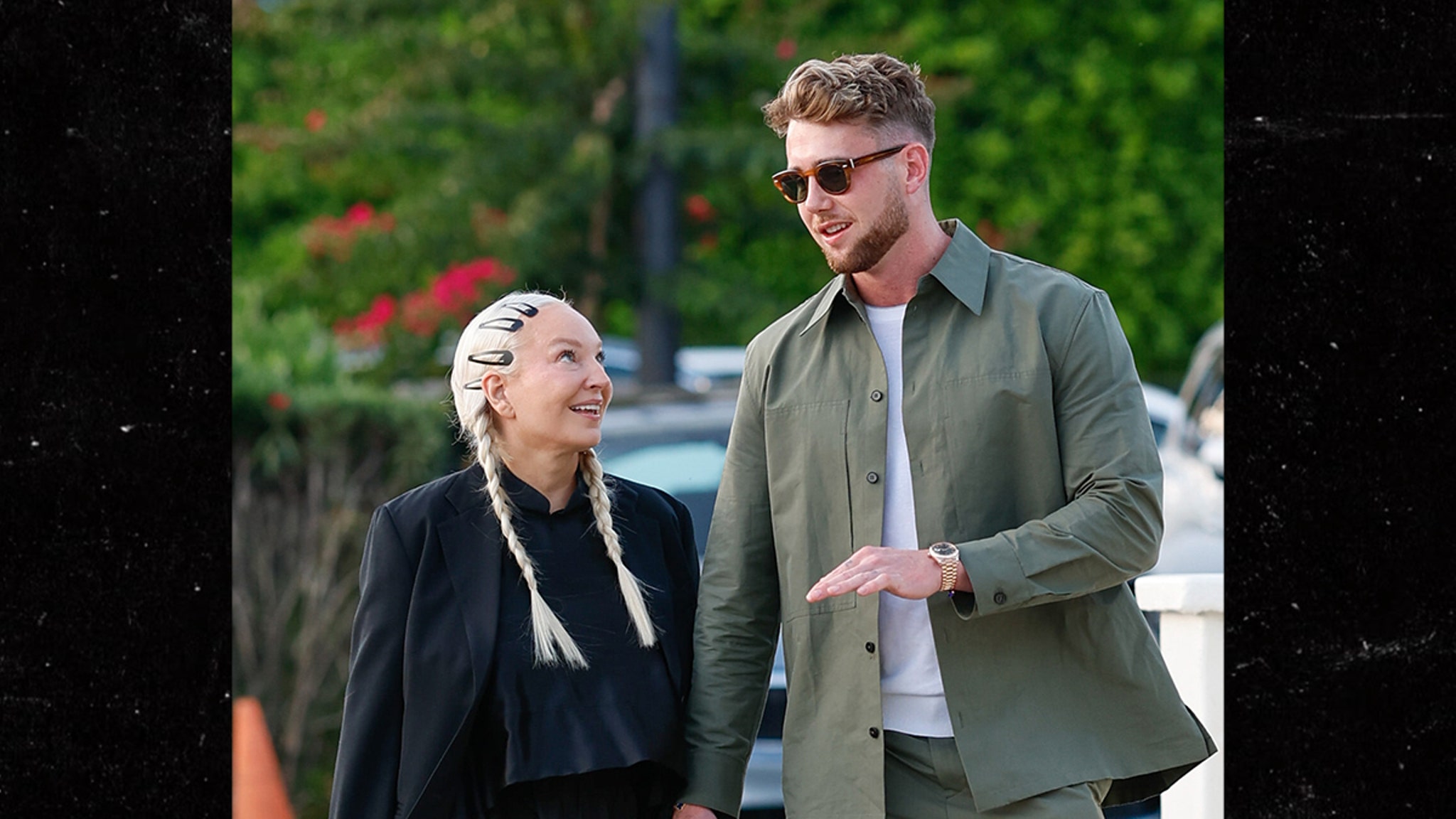 Sia holds hands with Harry Jowsey while he leaves the restaurant