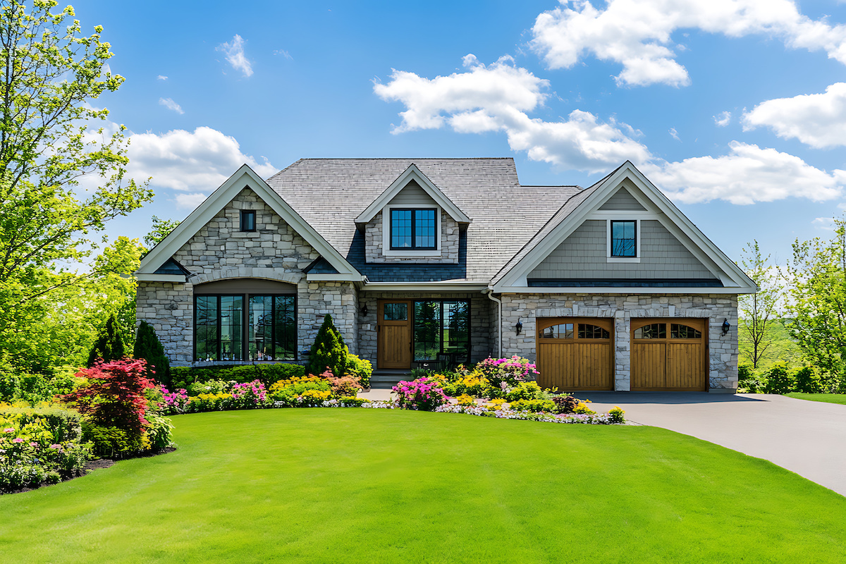 Highly detailed, bright, and clear photograph of a beautiful suburban home with a large front yard and a perfectly manicured lawn in the springtime.