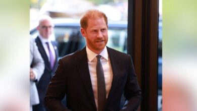 Prince Harry is embarrassing a small crowd during the rare British visit