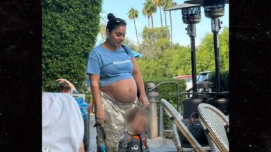 Vanessa Hudgens shows off her bare baby bump with husband Cole Tucker