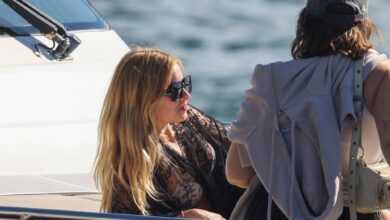 Addison Rae sunbathes in a bikini on a yacht in Sydney