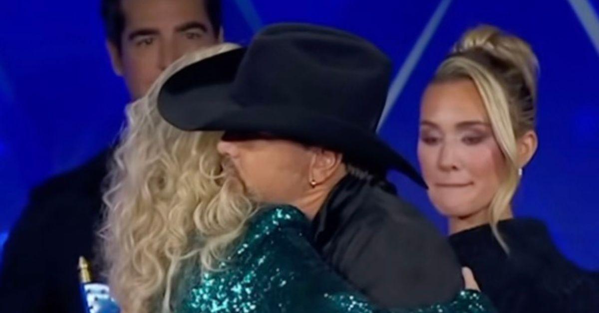 Erika Kirk's hug with Jason Aldean signals 'trouble is near,' claims body expert