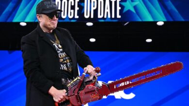 Elon Musk wearing a black Make America Great Again hat, a gold chain and a chainsaw for a Doge update