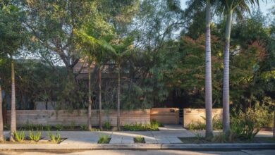 Discreet from the street, this home's mature foliage provides both shade and privacy.