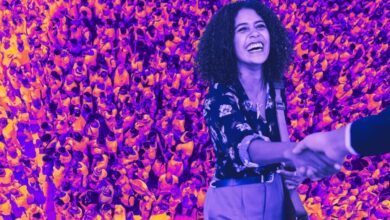 A picture of a woman shaking hands with someone, indicating that the deal is done and she's avoided these real estate lead generation mistakes.