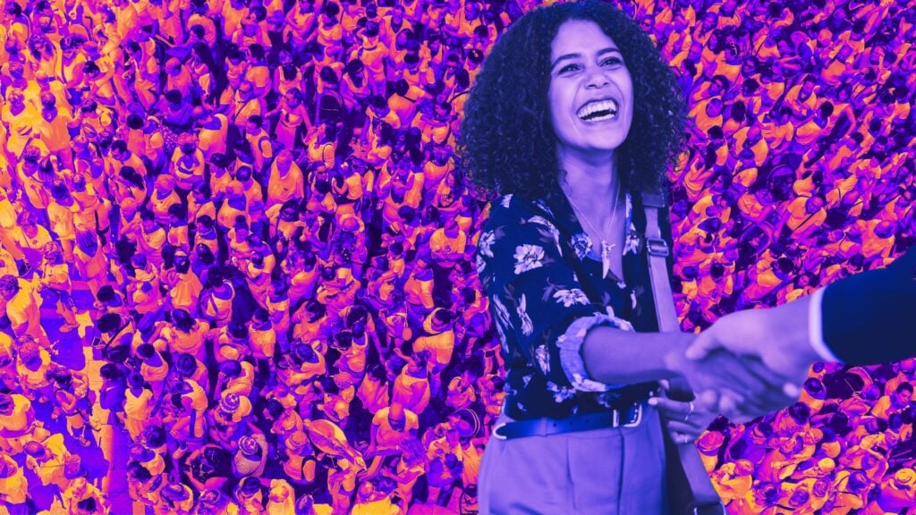 A picture of a woman shaking hands with someone, indicating that the deal is done and she's avoided these real estate lead generation mistakes.