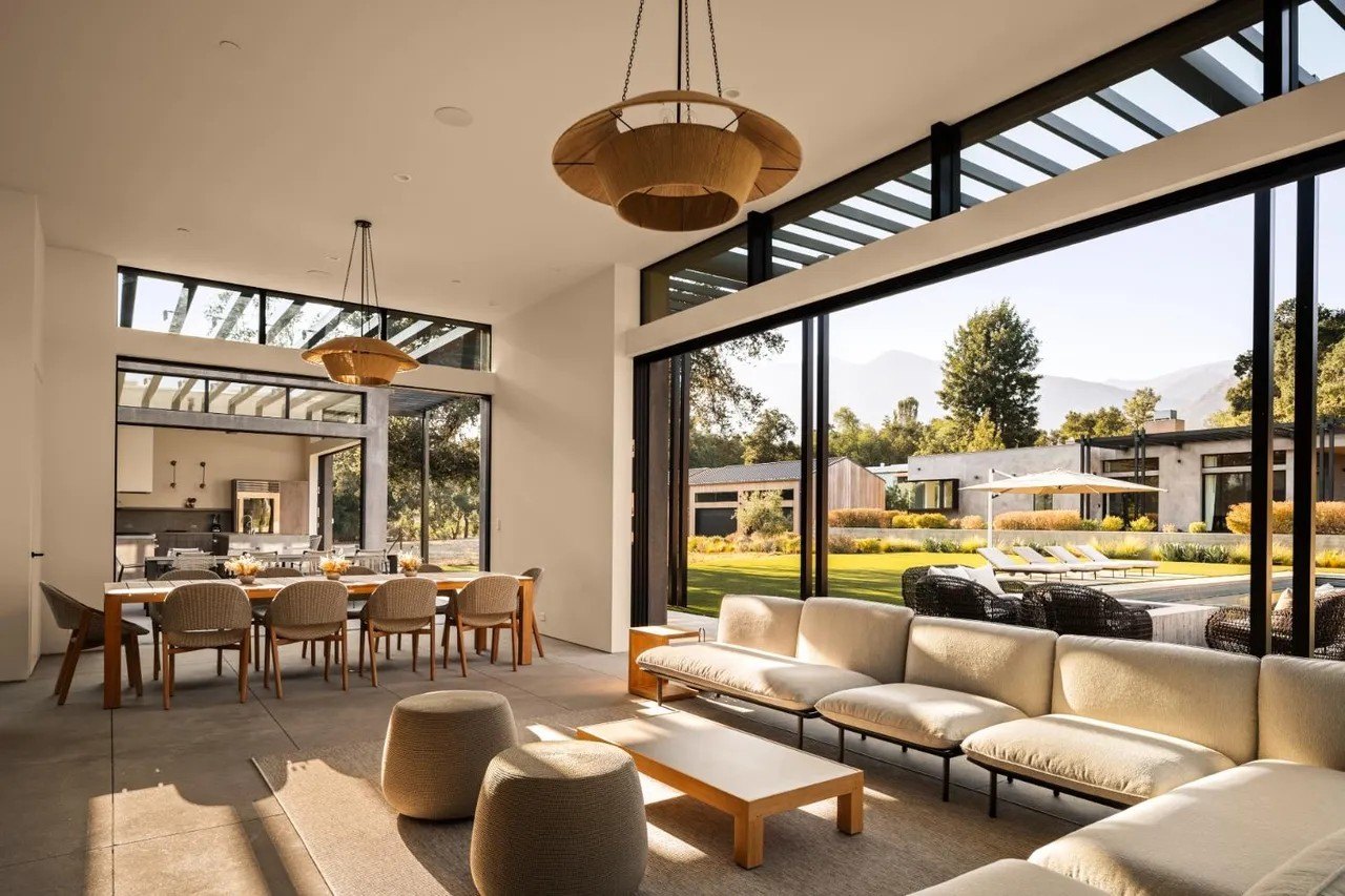 This beautiful pool pavilion illustrates how all spaces are extremely generous and feature floor-to-ceiling windows and glass doors leading to the ultimate indoor/outdoor experience.