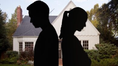 A shadow of two people who are dissatisfied with each other and a house in the background