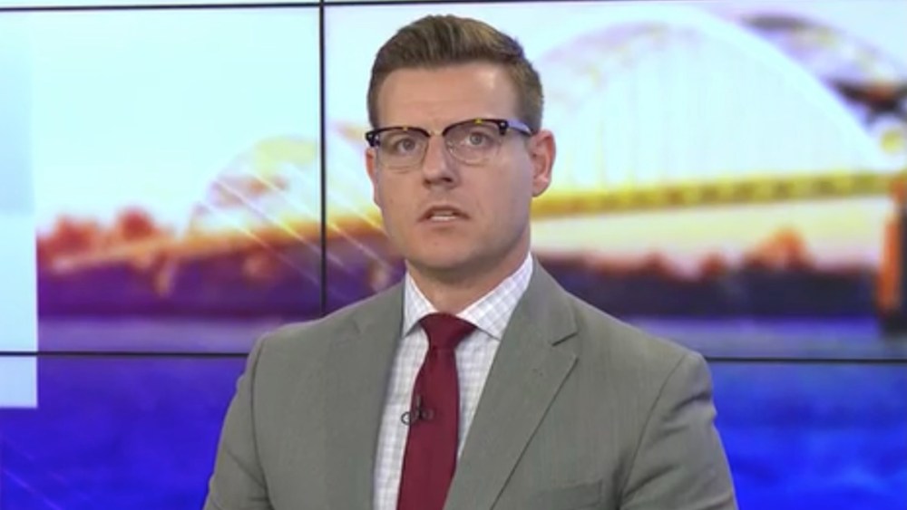 Iowa anchor Dustin Nolan shouts "Sanitized News" as he stops broadcasting